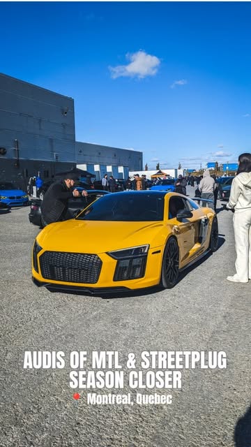 Yellow R8 V10 at the Season Closer with a crowd behind it.